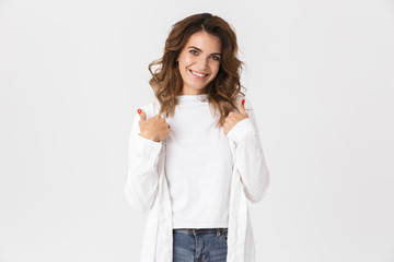 Portrait of joyful woman 30s in casual clothes smiling while standing, isolated over white background
