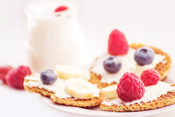   Delicious breakfast with fresh berries and yogurt.Very soft selective focus.
