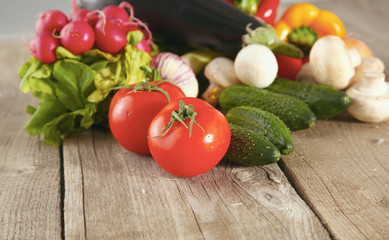 Composition with assorted raw organic vegetables wooden table