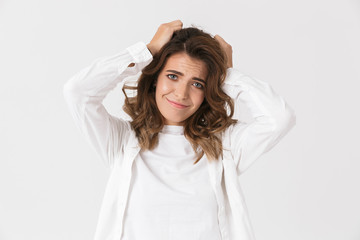 Naklejka premium Portrait of joyful woman 30s in casual clothes standing, isolated over white background