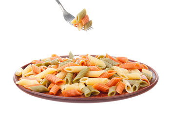 Penne rigate in porcelain bowl isolated on white background