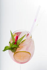 Glass of fresh cocktail on white background