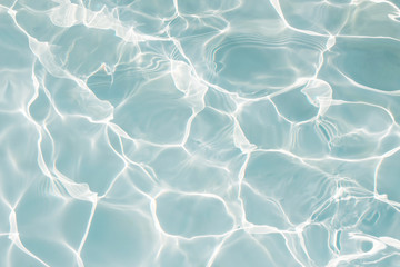 Texture of water in swimming pool for background