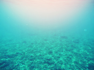 Photo of sea under water, blue lagoon, light of sun from surface