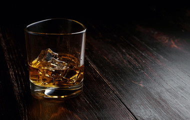 whiskey with ice in modern glasses