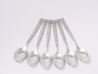 silverware forks spoons knives cutlery on a white background