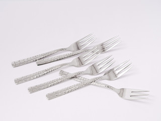 silverware forks spoons knives cutlery on a white background
