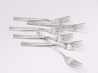 silverware forks spoons knives cutlery on a white background