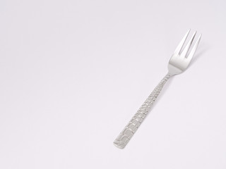 silverware forks spoons knives cutlery on a white background