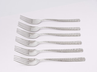 silverware forks spoons knives cutlery on a white background