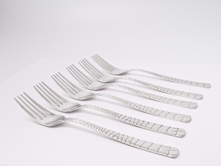 silverware forks spoons knives cutlery on a white background