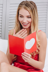 woman reading gift card for valentines day
