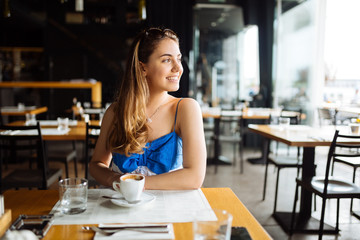 Beautiful woman enjoying her coffee