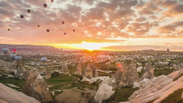 Hot air balloons takeoff at sunrise in Cappadocia