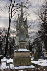 Fototapeta na wymiar ancient Christian gravestone in the cemetery in Krakow, Poland