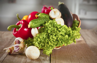 Composition with assorted raw organic vegetables wooden table
