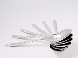 silverware forks spoons knives cutlery on a white background