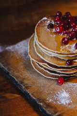 Pancakes with cranberries and maple syrup
