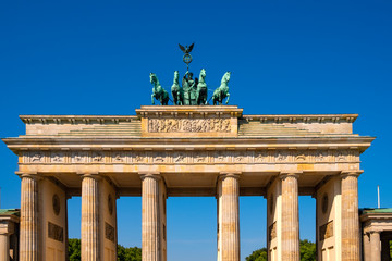 Berlin, Germany - Closeup of the Quadriga with Victoria goddess of victory sculpture atop the Brandenburg Gate - Brandenburger Tor - at Pariser Platz square in historic quarter of West Berlin