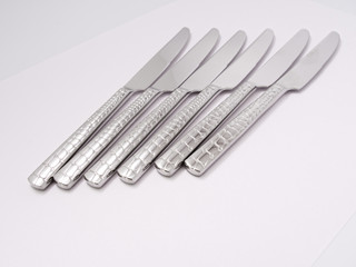 silverware forks spoons knives cutlery on a white background