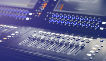 Light and Sound control mixer for Event on stage. Professional backstage device equipment. Professional sound and audio mixer control panel with buttons and sliders.