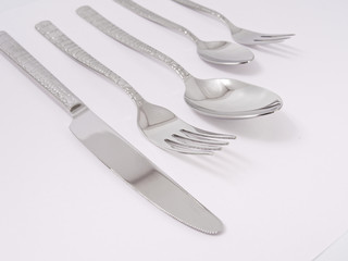 silverware forks spoons knives cutlery on a white background