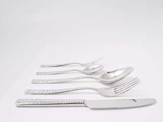 silverware forks spoons knives cutlery on a white background