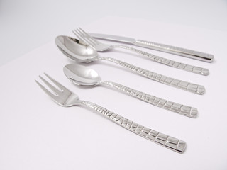 silverware forks spoons knives cutlery on a white background