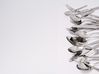 silverware forks spoons knives cutlery on a white background