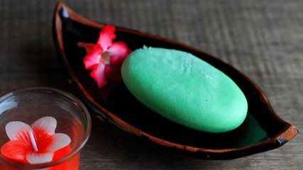 Green soap on a wooden background
