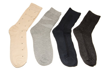 Four pairs of multi-colored thin socks. Thin, summer running socks. Isolated on white background.