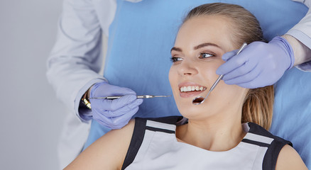 beautiful girl in the dental chair on the examination at the de