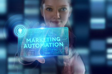 The concept of business, technology, the Internet and the network. A young entrepreneur working on a virtual screen of the future and sees the inscription: Marketing automation