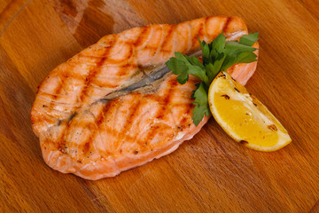 Grilled salmon served lemon and parsley