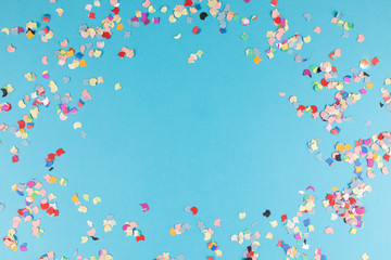 blue background with confetti - obrazy, fototapety, plakaty