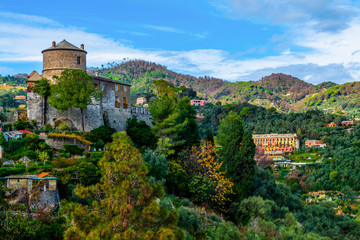 Fototapeta na wymiar Medieval castle on the top of the hill in the coastal italian city Portofino, Liguria, Italy