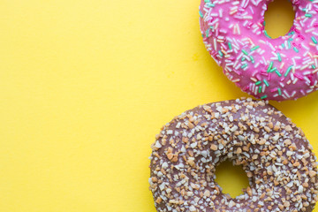School lunch box. Donats, candies, baby corns, carrot and tomatoes in green plastic container