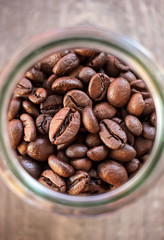 Toasted coffee beans in a glass jar