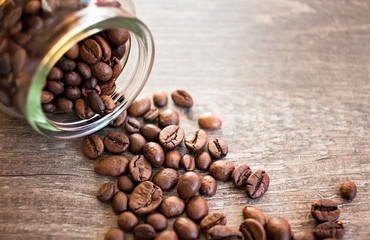 Toasted coffee beans in a glass jar