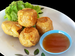 Deep Fried Crab meat roll ( Jock shell crab ) or  Hoi Jo Traditional local Chinese food for appetizer Food of Asian It is eaten .