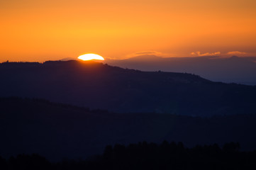 silhouette sunset mountain fog valley