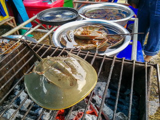 Horseshoe Crab Egg On the grill In the seafood market at Thailand .