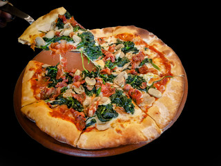 Pizza spinach slice with cheese on a wooden table In the restaurant. Italian menu food traditional cuisine .
