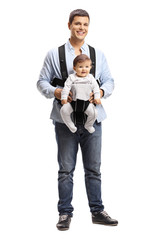 Young father with a baby in a carrier