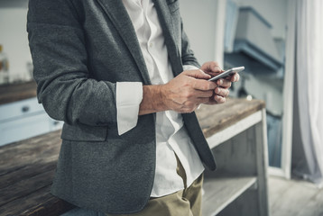 White collar worker typing message for his partner