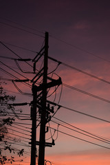 pylon electricity power line with sunset sky background