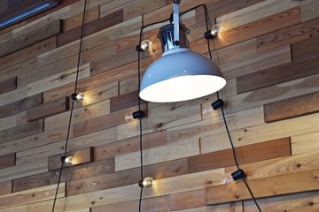 Wall design in the cafe.Lamps and bulbs on the cord.