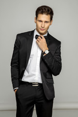 Portrait of handsome man in black suit