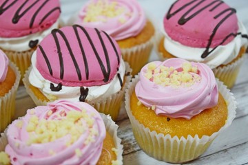 Delicious cakes on wooden background.Sweet dessert for coffee.