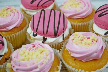 Delicious cakes on wooden background.Sweet dessert for coffee.